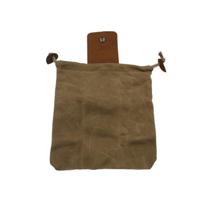 Unisex foraging pouch in a natural canvas color with rich brown leather accents, great for hiking trips.