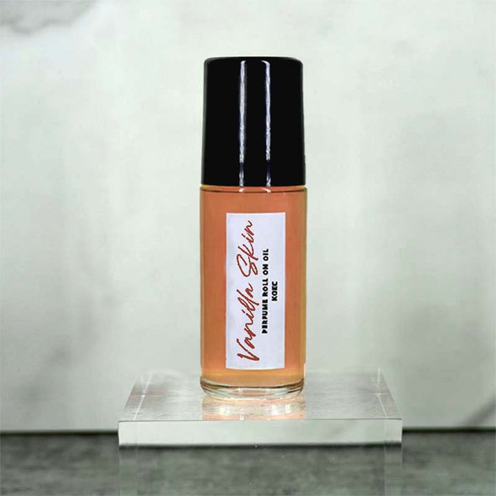 Open Captivating Roll-On Fragrance Oil, with applicator visible, showcasing the smooth application of peach vanilla oil.