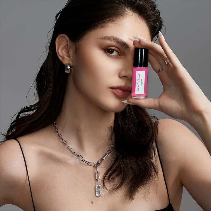 Close-up of Unisex Captivating Roll-On Fragrance Oil bottle, highlighting its sleek design and key ingredients.