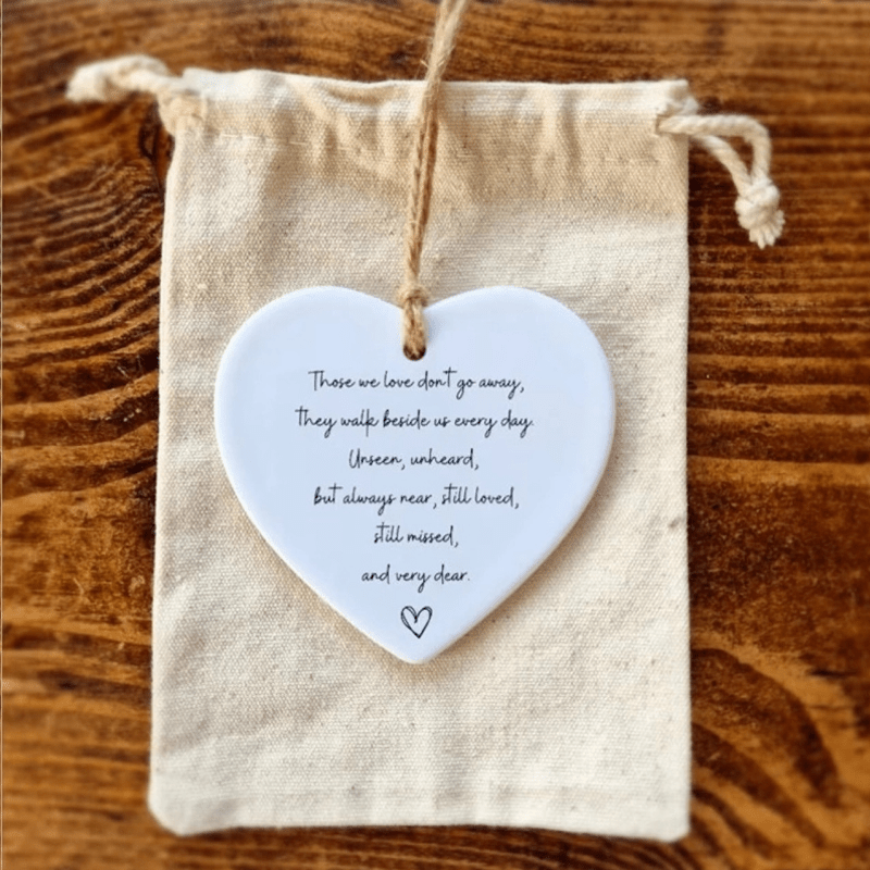 Artfully designed ceramic heart ornament, featuring a powerful quote, making it an ideal sentimental gift.