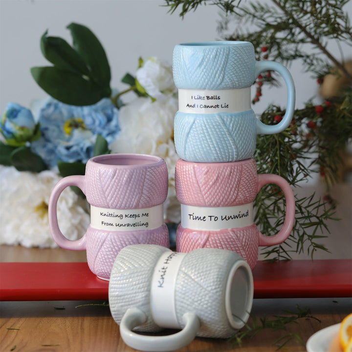 Ergonomic handle on a unisex knitting yarn ball ceramic mug, great for hot beverages and gifting.