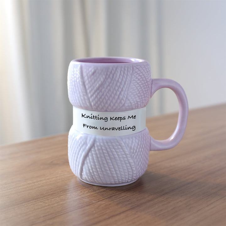 Versatile ceramic mug with a distinctive knitting yarn ball pattern, excellent for any hot drink.