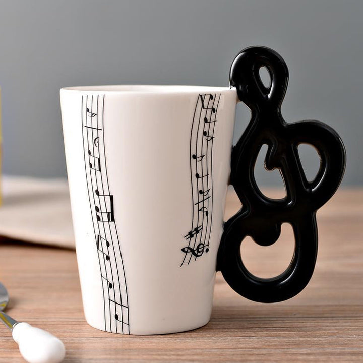 Guitar handle mug, ergonomic design, musical instrument themed ceramic drinkware for daily use