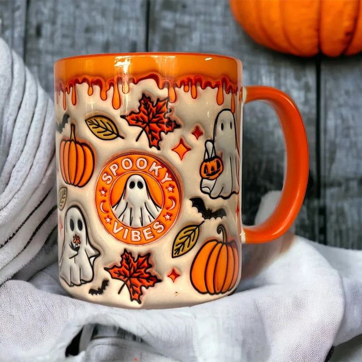 Decorative pumpkin-shaped coffee mug featuring a cute ghost, ideal for fall season drinkware and Halloween decor.