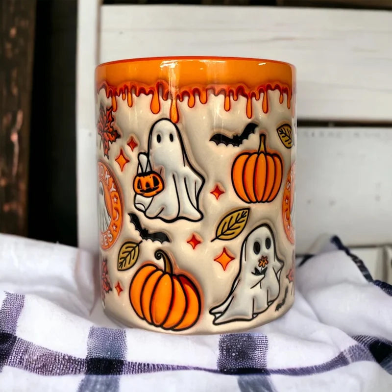 Festive pumpkin coffee cup with a cheerful ghost, suitable for autumn drinkware and Halloween themed gifts.