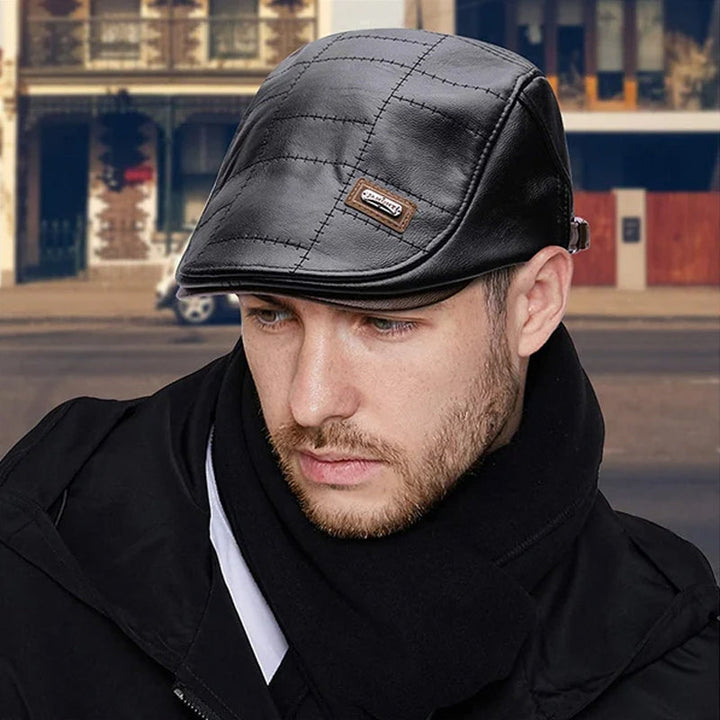 Close-up of a classic faux leather beret, highlighting the smooth texture and unisex design.