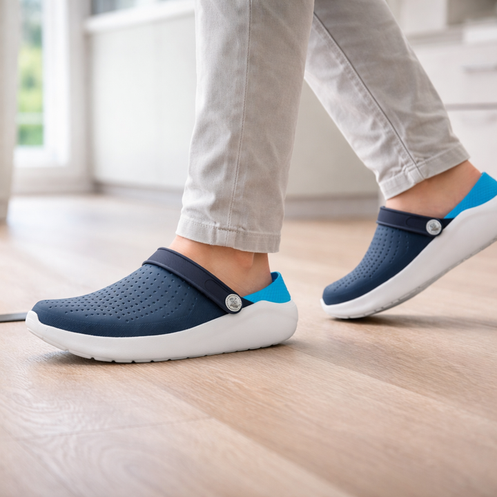 Black cushioned comfort sandals with flexible sole & arch support for all-day comfort.