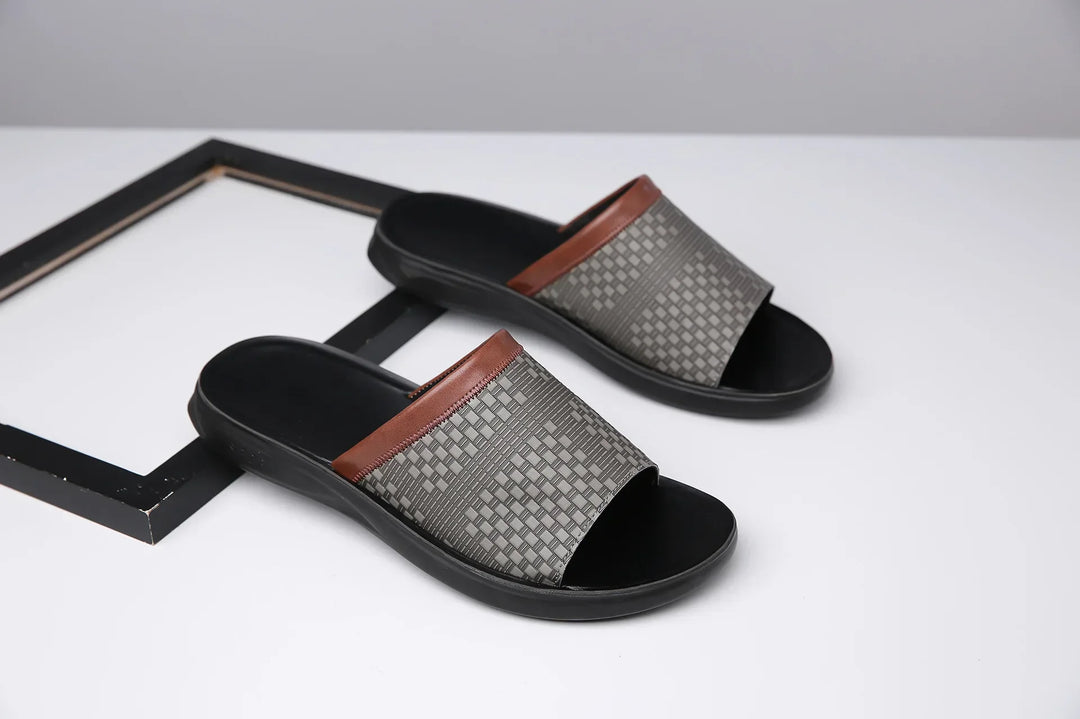 Woven strap comfort slide sandals on a beach, illustrating their use as summer footwear