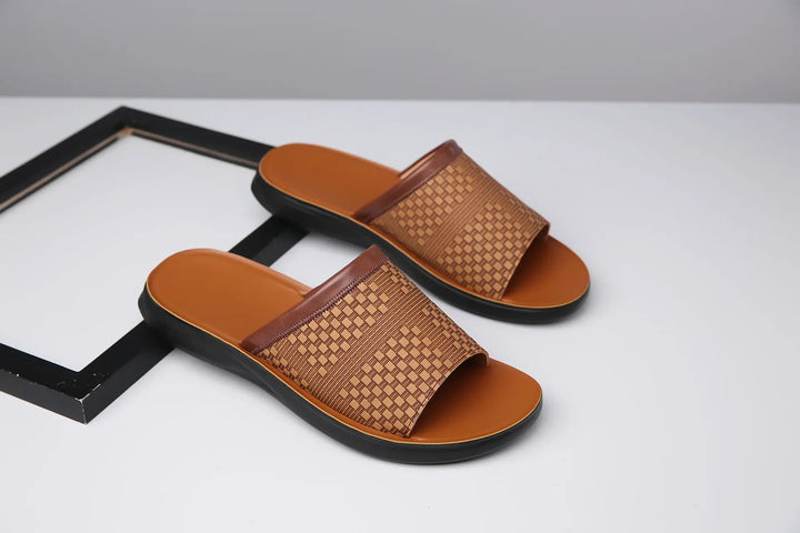 Front view of unisex slide sandals, showcasing the wide woven strap for a secure fit