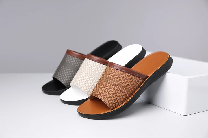 Back view of comfort slide sandals with a woven strap, displaying the durable sole