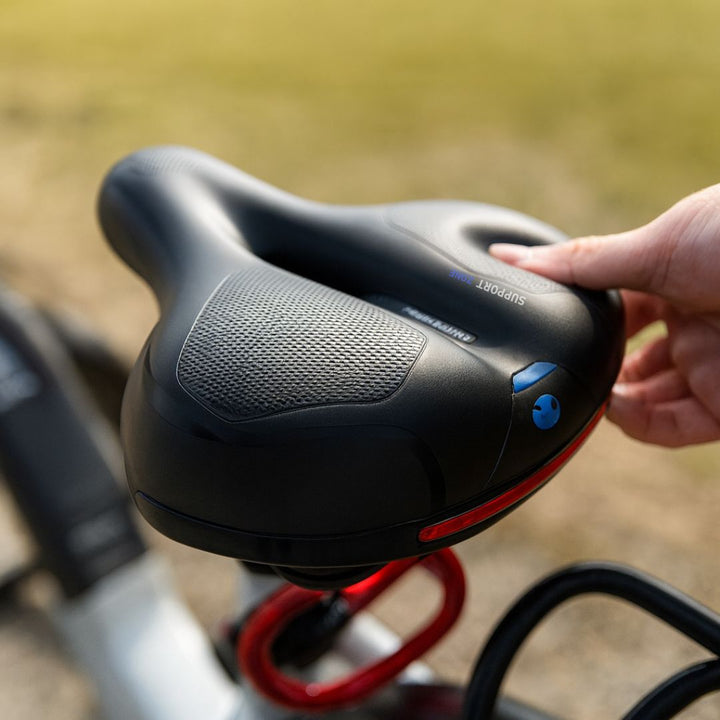 Deluxe black suspension bike seat with ergonomic design & soft cushioning for ultimate cycling comfort.