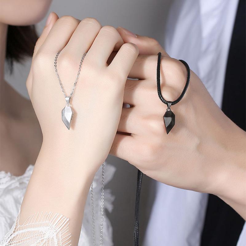 Pair of matching heart stitching necklaces for couples, showcasing symbolic alloy design