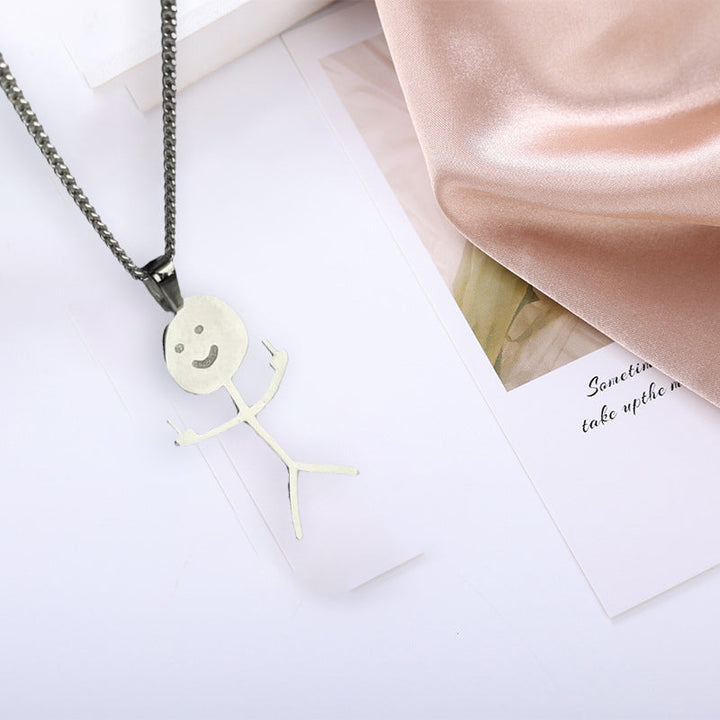 Side view of a unisex doodle pendant necklace, showcasing its intricate design and chain