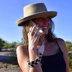Hands-free phone solution: a unisex crossbody strap with an attached zipper pouch for maximum convenience.