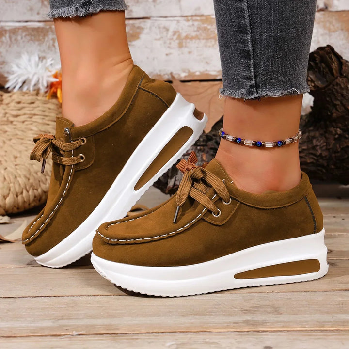 A collection of Unisex Cushioned Walking Shoes in various colors: black, white, and blue