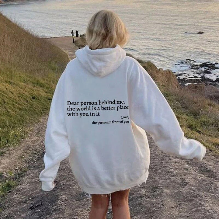 Flat lay of 'Dear Person Behind Me' inspirational sweatshirt, unisex apparel, kindness clothing