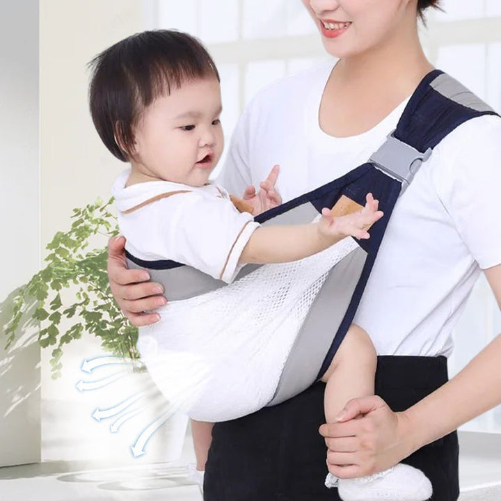 Adjustable baby sling in black, providing ergonomic support for both baby and parent.