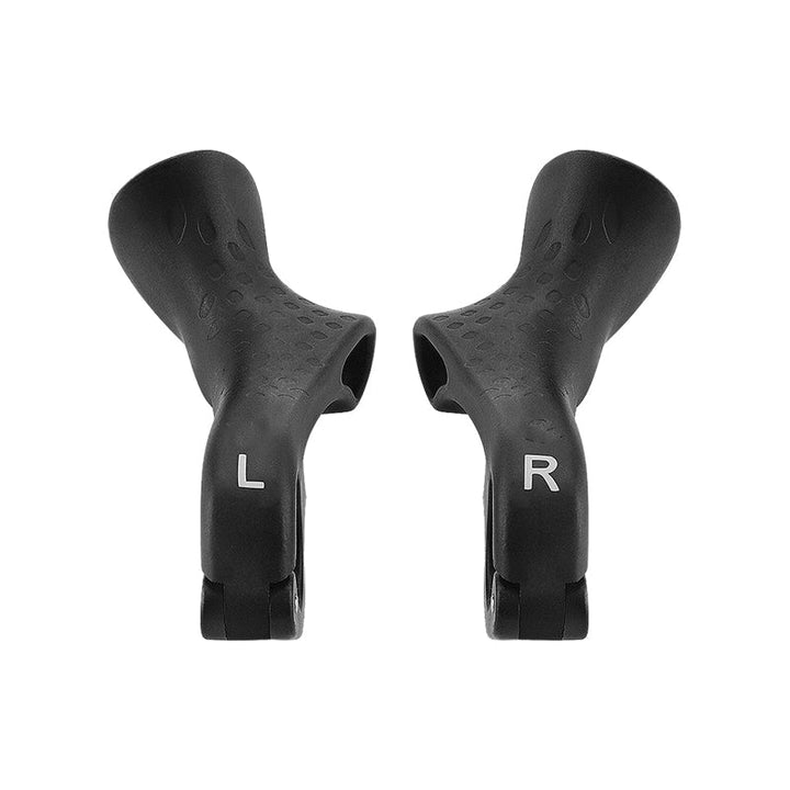 Close-up of ergonomic bicycle handlebar grips, textured for enhanced cycling comfort & firm grip.