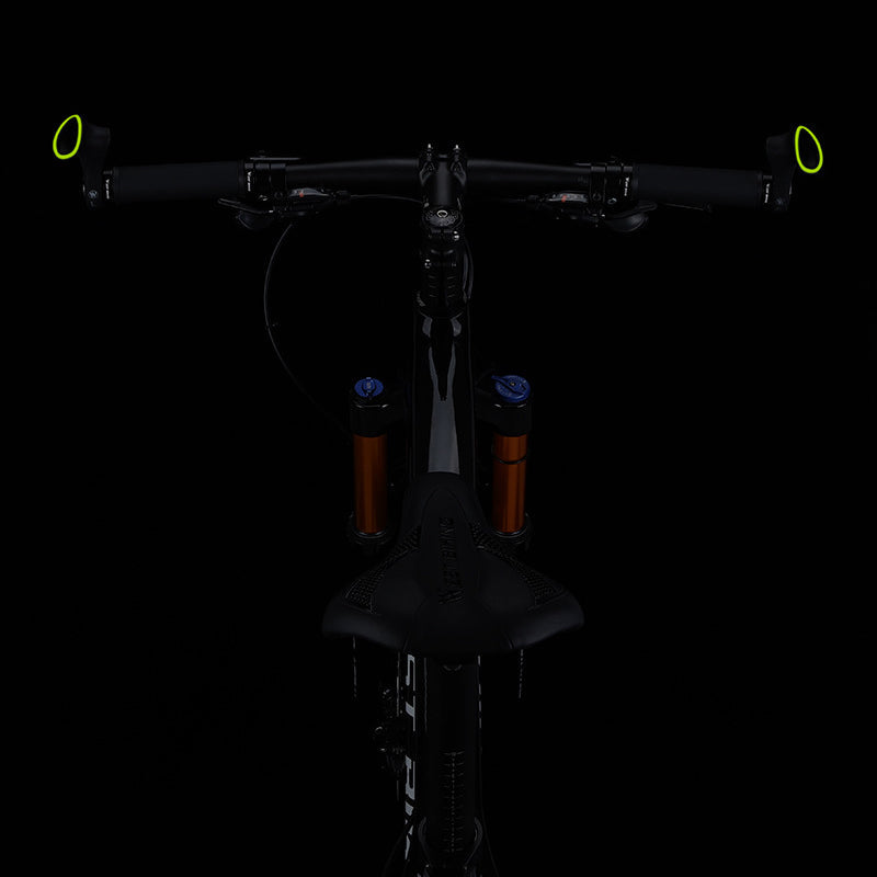 Black ergonomic bicycle handlebar grips with non-slip texture for enhanced safety & comfort.