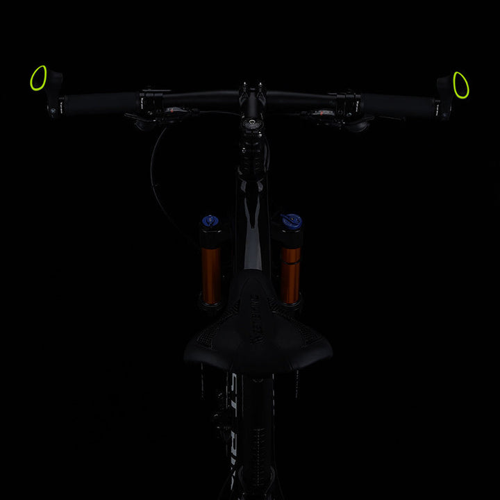 Black ergonomic bicycle handlebar grips with non-slip texture for enhanced safety & comfort.