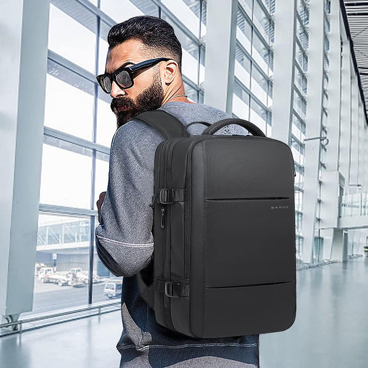 Travel backpack (26-45L) as carry-on luggage beside a plane.