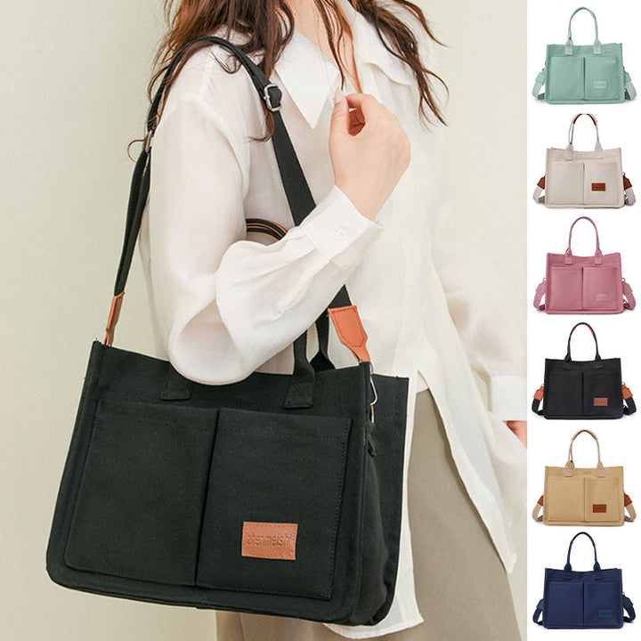 Unisex fashion canvas crossbody bag in a neutral color, perfect for everyday use or travel.