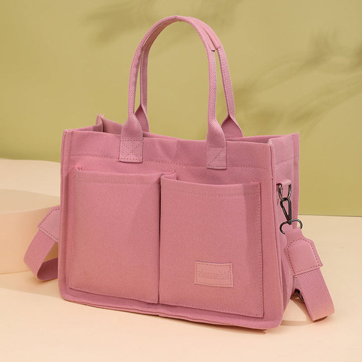 Versatile canvas crossbody bag, perfect for students, commuters, and travelers alike.