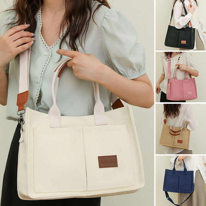 Back view of a canvas shoulder bag, showing its sleek profile and comfortable wear.