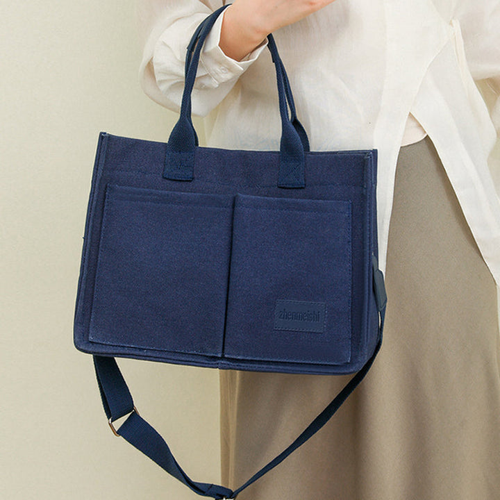 Casual unisex shoulder bag made from high-quality canvas, ideal for daily essentials.