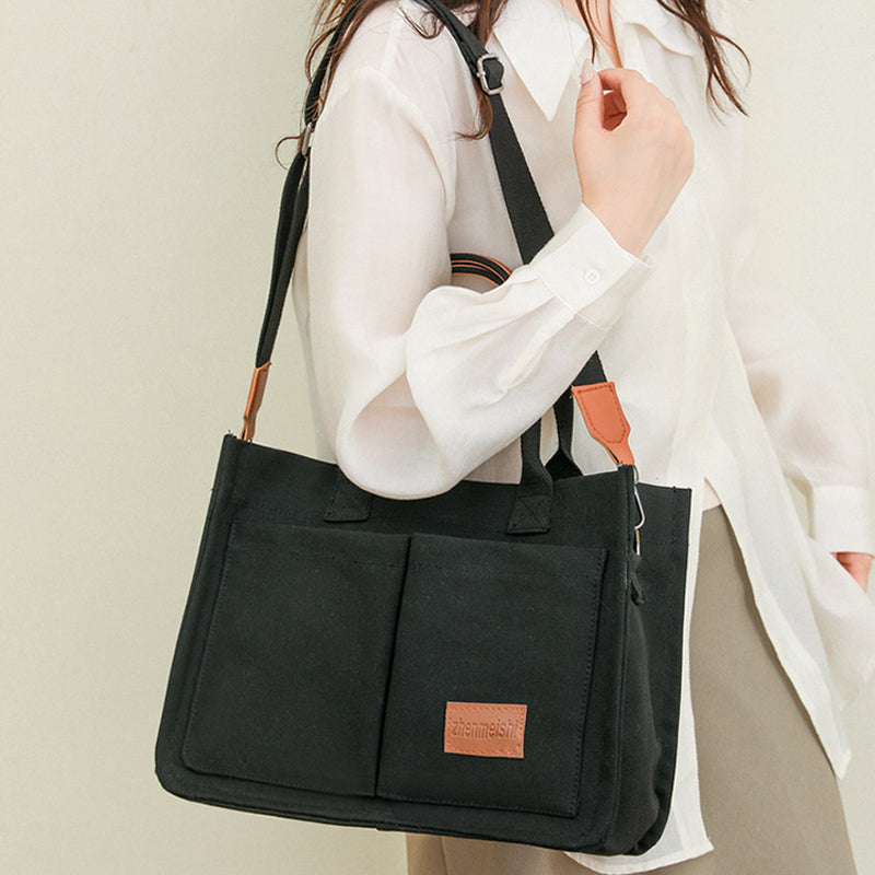 Fashionable canvas crossbody bag with adjustable strap, a practical travel companion.