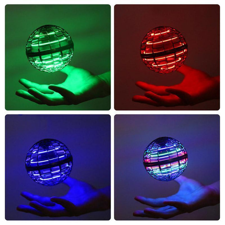 Group of kids and adults playing with a magical LED flying orb toy in a dimly lit room
