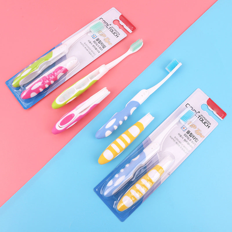 Portable folding toothbrush, white bristles, ideal for travel hygiene and oral care