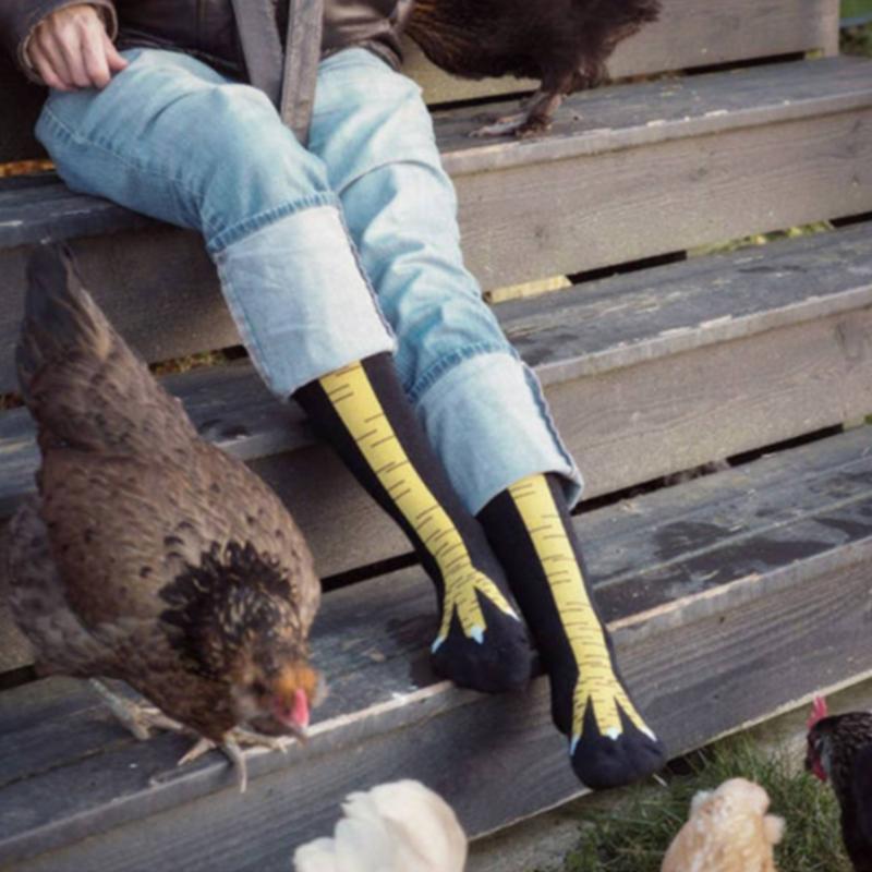 Pair of novelty chicken leg socks, made from soft cotton, displayed for a humorous effect.