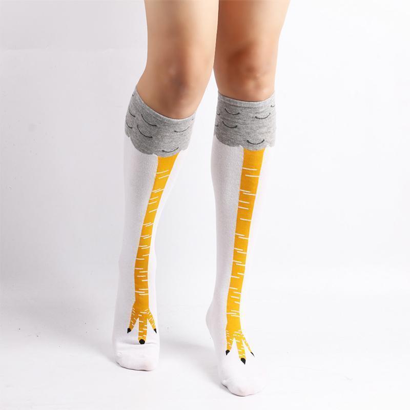 Novelty socks with a chicken leg design, shown folded, emphasizing the playful and funny pattern.