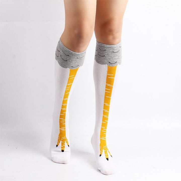 Novelty socks with a chicken leg design, shown folded, emphasizing the playful and funny pattern.