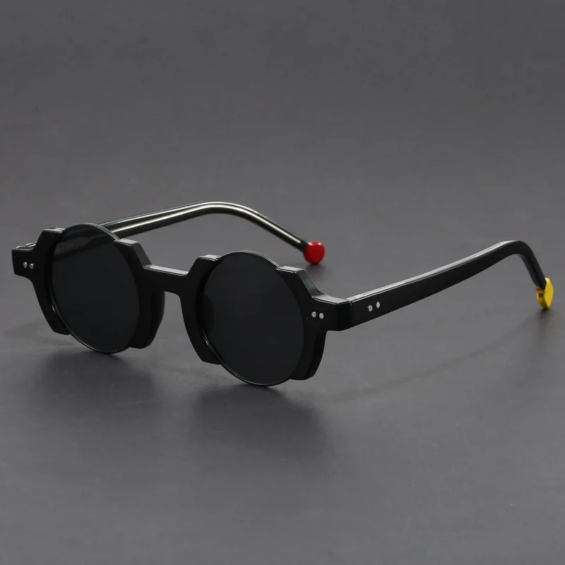 Unisex futuristic round frame sunglasses from the front, featuring bold lines and UV protective eyewear.