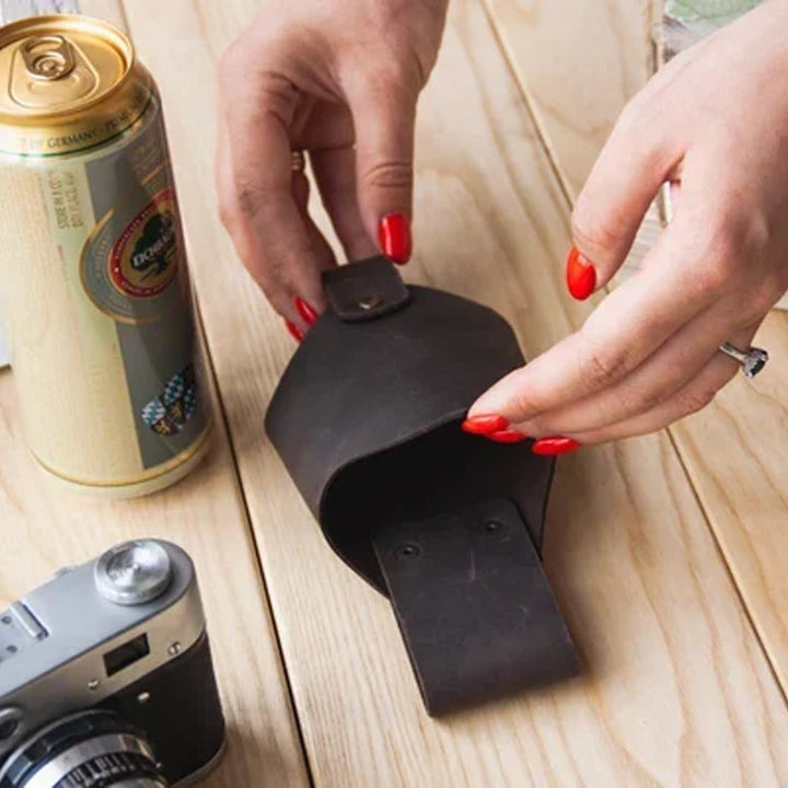 Person wearing an antique finish leather belt drink holder, ready for adventure