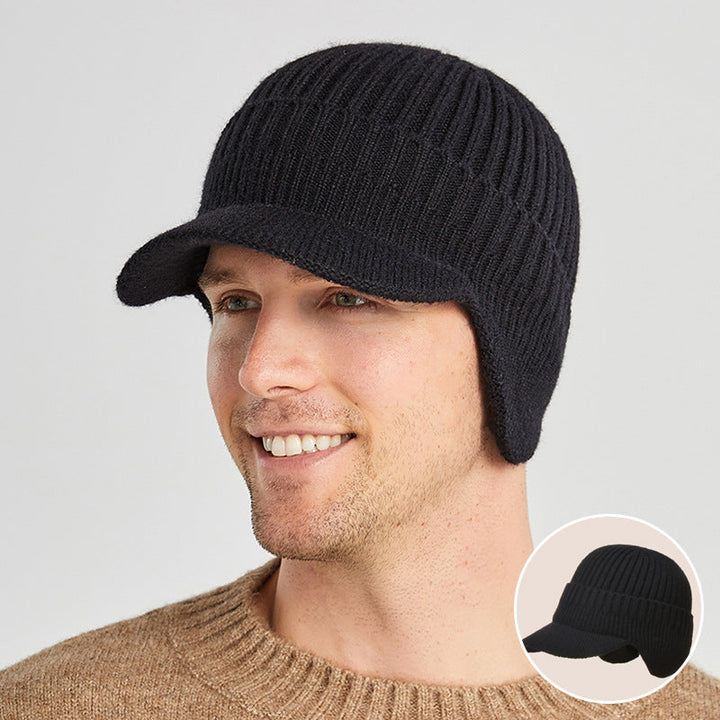 Warm acrylic knit beanie in black, featuring ear protection for cold weather sports.