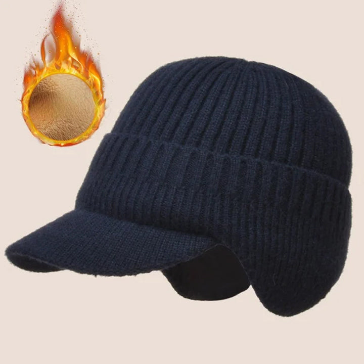 Folded knit beanie in red, showing the integrated ear protection for winter use.