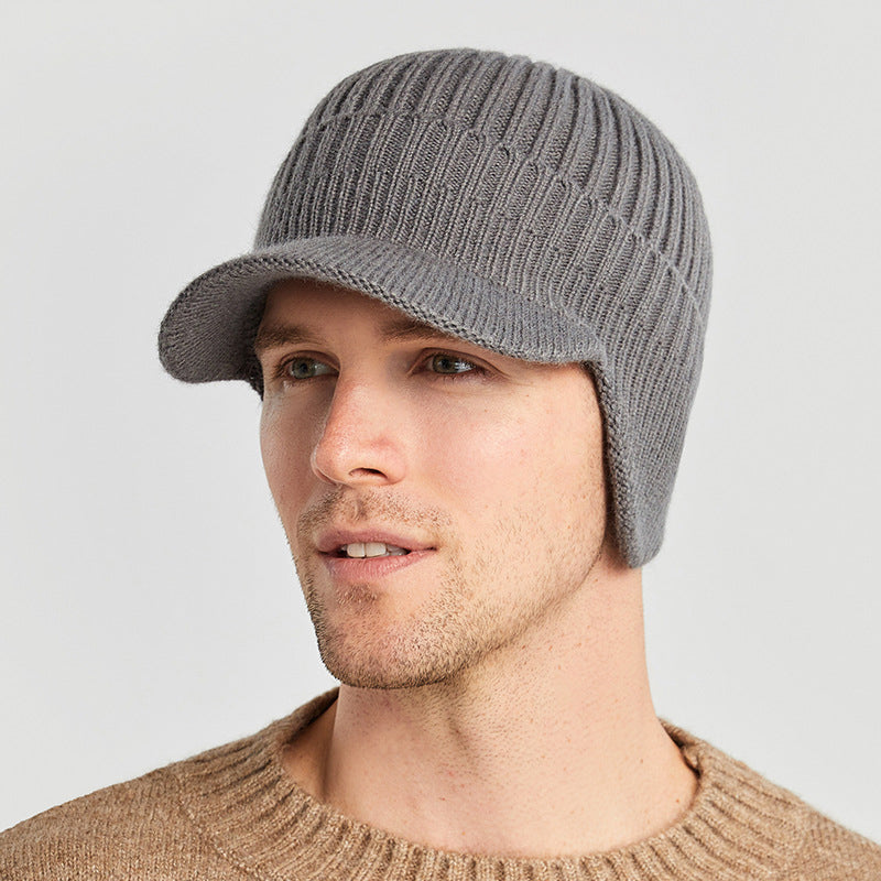 Front view of an outdoor knit beanie in red, designed for unisex ear protection.