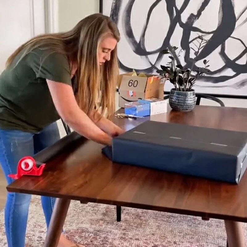 Holiday gift wrapping tool set with adjustable table clamp and integrated tape dispenser for easy organization