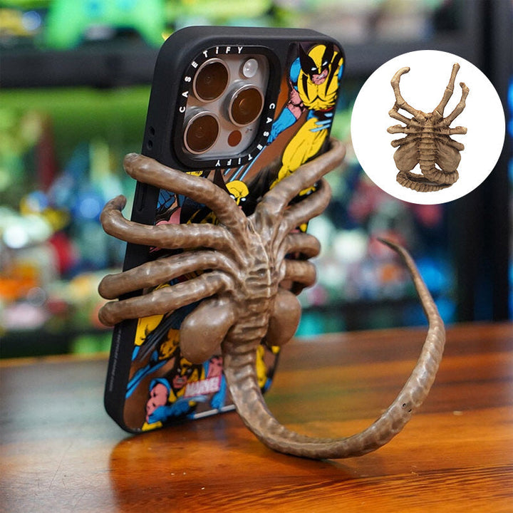Unisex Horrible Creature Phone Holder Stand, a quirky sci-fi horror desk accessory for phones.