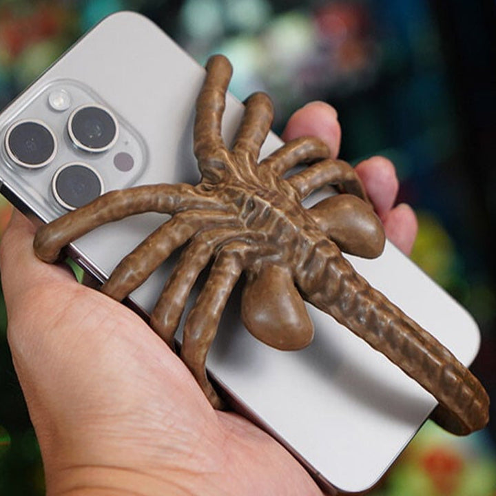 Unique Horrible Creature Phone Holder, a striking horror-themed gadget and desk decor.