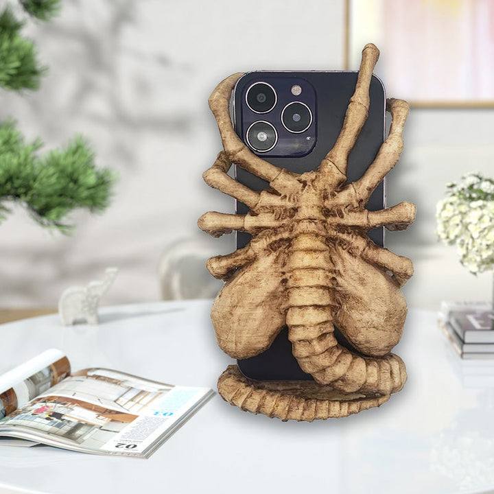 Angled shot of the resin Horrible Creature Phone Holder, highlighting its unique texture.