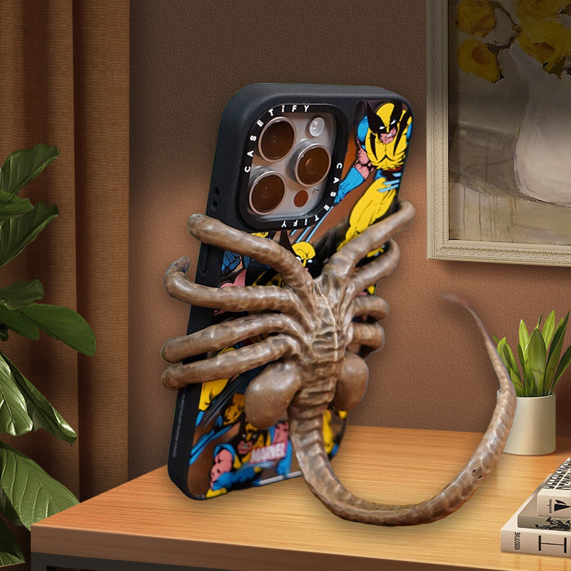 Horror-themed Horrible Creature Phone Holder, a perfect quirky gift for sci-fi fans.