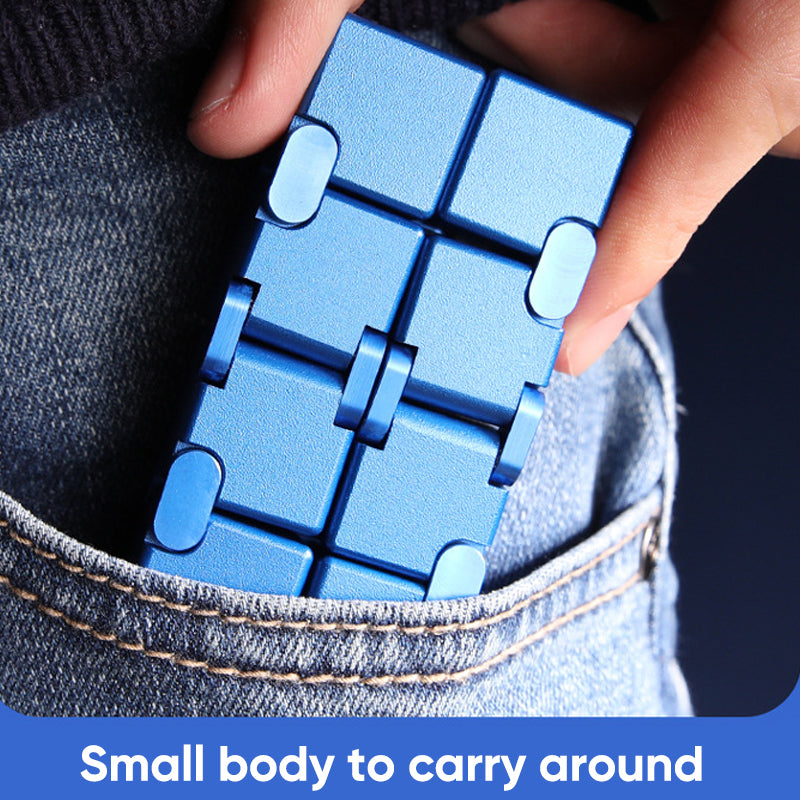 Close-up of Infinity Fidget Stress Relief Cube, revealing intricate metallic design