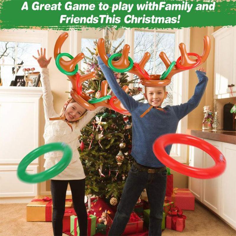 Kids playing inflatable reindeer antler ring toss game, festive Christmas toy for holidays