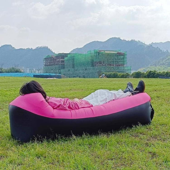 Quick-inflate, no-pump outdoor lounger. Portable sofa bed provides ergonomic support for relaxation.