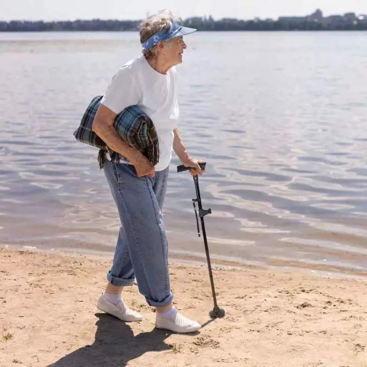 Unisex LED folding walking cane with built-in light, adjustable for seniors & elderly mobility aid.