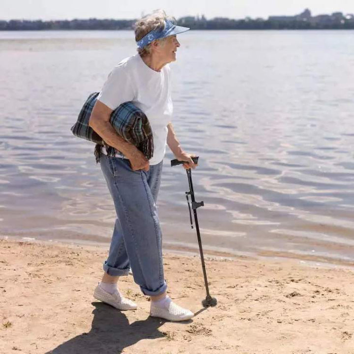 Unisex LED folding walking cane with built-in light, adjustable for seniors & elderly mobility aid.